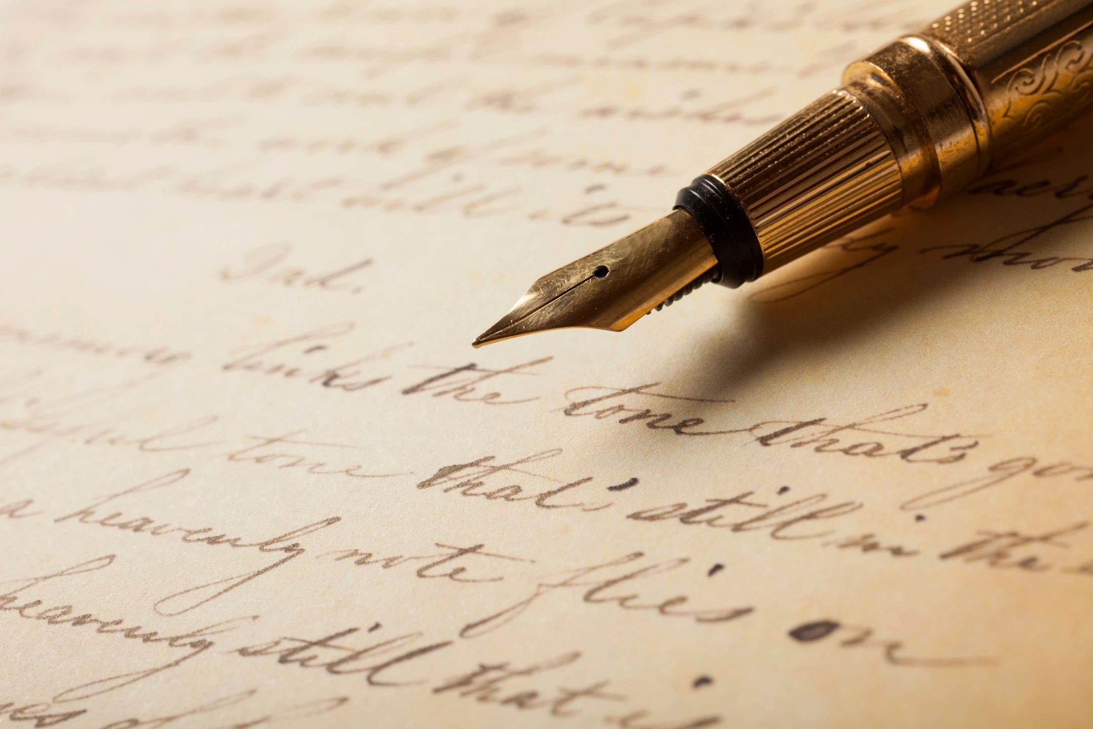 Vintage fountain pen on handwritten page