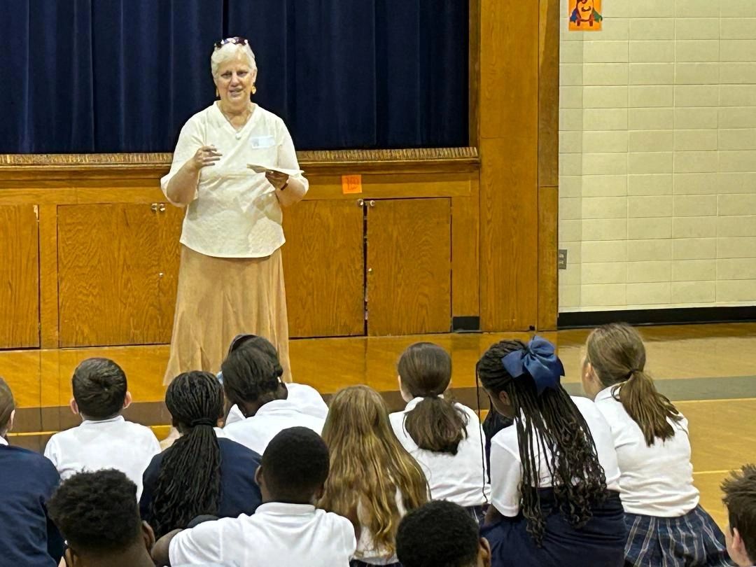 Mary T speaking to students